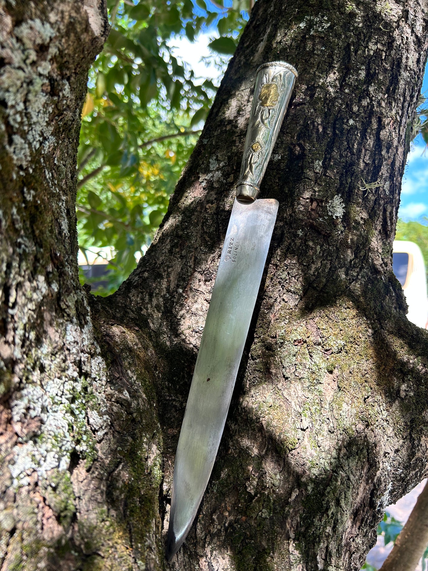 Faca de flores de alpaca e bronze