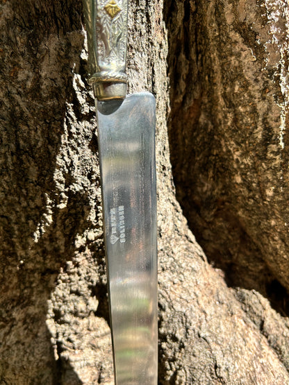 Faca de flores de alpaca e bronze